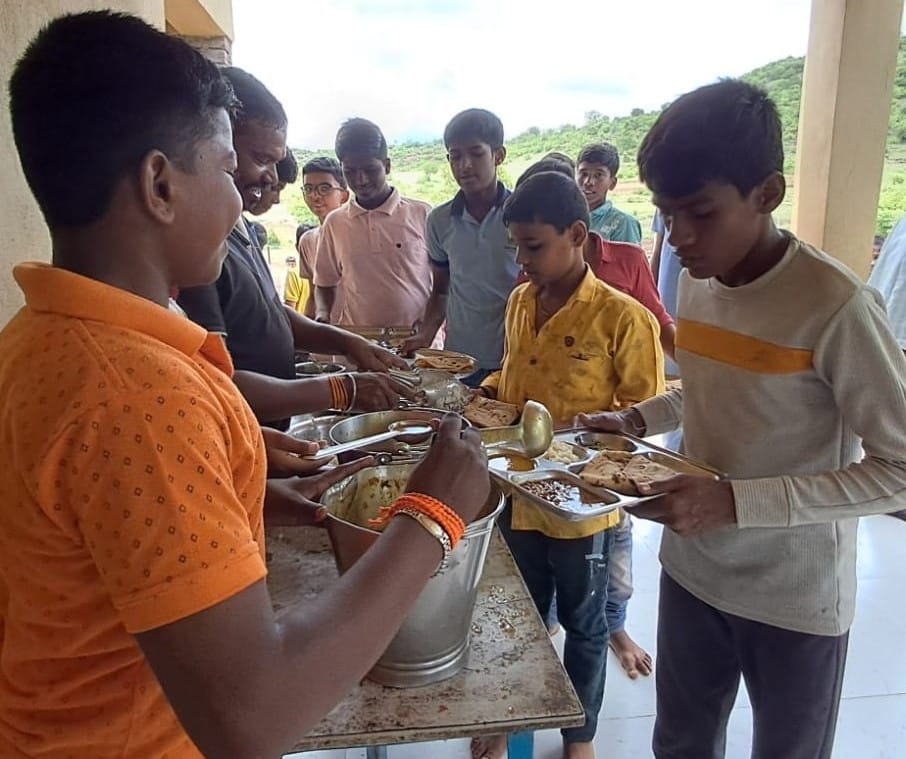Students having meals in the newly constructed kitchen unit- Amrutalaya